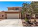 Inviting two-story home with a well-maintained yard and a two-car garage, perfect for suburban living at 2037 Merano Ct, Las Vegas, NV 89123