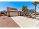 Lovely two-story home with a two-car garage, manicured landscaping, and a welcoming entrance at 2037 Merano Ct, Las Vegas, NV 89123