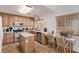 Functional kitchen with wood cabinets, an island, and stainless steel appliances at 2037 Merano Ct, Las Vegas, NV 89123