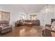 Inviting living room featuring vaulted ceilings, neutral paint, and tile flooring at 2037 Merano Ct, Las Vegas, NV 89123
