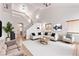 Bright living room with vaulted ceilings, neutral paint, and tile flooring at 2037 Merano Ct, Las Vegas, NV 89123