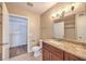 Bathroom featuring granite countertop, tile floors, and walk-in closet at 2120 Ramrod Ave # 2216, Henderson, NV 89014