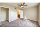 Bedroom with carpet, ceiling fan, and an ensuite bathroom featuring granite countertops at 2120 Ramrod Ave # 2216, Henderson, NV 89014