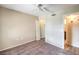 Cozy bedroom with carpet, ceiling fan, closet, and view into bathroom at 2120 Ramrod Ave # 2216, Henderson, NV 89014