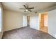 Bedroom features carpet, a ceiling fan, and an ensuite bathroom at 2120 Ramrod Ave # 2216, Henderson, NV 89014