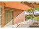 Inviting condo entrance featuring a neutral-colored door, textured walls, and a manicured lawn at 2120 Ramrod Ave # 2216, Henderson, NV 89014