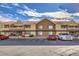 Apartment building with covered parking, balconies and mature landscaping under a blue sky at 2120 Ramrod Ave # 2216, Henderson, NV 89014