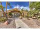 Exterior view of the fitness center with manicured landscaping and a walkway leading to the entrance at 2120 Ramrod Ave # 2216, Henderson, NV 89014