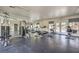 Fitness room with weight machines, treadmills, exercise bikes, mirrored wall, and an exit to the outside at 2120 Ramrod Ave # 2216, Henderson, NV 89014