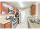 A kitchen featuring stainless steel appliances, granite countertops and ample cabinet space at 2120 Ramrod Ave # 2216, Henderson, NV 89014