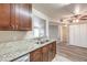 A kitchen featuring granite countertops and stainless steel appliances with hardwood floors at 2120 Ramrod Ave # 2216, Henderson, NV 89014