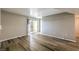 Inviting living room with hardwood floors and sliding doors to a private balcony at 2120 Ramrod Ave # 2216, Henderson, NV 89014