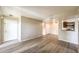 Open concept living space with hardwood floors, providing seamless flow to the front door and kitchen at 2120 Ramrod Ave # 2216, Henderson, NV 89014