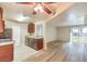 Open concept kitchen and living area with stainless steel appliances and hardwood floors at 2120 Ramrod Ave # 2216, Henderson, NV 89014