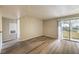Comfortable living area featuring hardwood flooring and access to an outdoor balcony at 2120 Ramrod Ave # 2216, Henderson, NV 89014