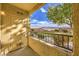 Private patio with railing, view of yard, and storage closet at 2120 Ramrod Ave # 2216, Henderson, NV 89014