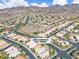 Elevated view of suburban houses at 2271 Smokey Sky Drive, backed by picturesque mountains at 2271 Smokey Sky Dr, Henderson, NV 89052