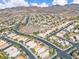 High angle view of a neighborhood featuring lush landscaping and distant mountain range at 2271 Smokey Sky Dr, Henderson, NV 89052