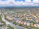 Wide aerial view of a well-maintained suburban neighborhood with a clear blue sky backdrop at 2271 Smokey Sky Dr, Henderson, NV 89052