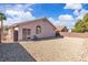 Well-maintained backyard featuring xeriscaping, a privacy fence, and a covered patio at 2271 Smokey Sky Dr, Henderson, NV 89052
