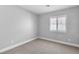 This bedroom has neutral walls, plush carpet and plantation shutters for natural light at 2271 Smokey Sky Dr, Henderson, NV 89052