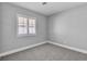 This bedroom has neutral walls, plush carpet and plantation shutters for natural light at 2271 Smokey Sky Dr, Henderson, NV 89052