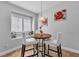 Cozy breakfast nook with a round table, comfortable chairs, and bright, natural light at 2271 Smokey Sky Dr, Henderson, NV 89052