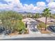Beautiful single-story home with tile roof, two-car garage, and mature landscaping at 2271 Smokey Sky Dr, Henderson, NV 89052