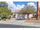 Charming single-story home with a two-car garage, xeriscaped front yard, and a classic tile roof at 2271 Smokey Sky Dr, Henderson, NV 89052