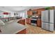 Well-equipped kitchen with stainless steel appliances, wooden cabinets, and stylish countertops at 2271 Smokey Sky Dr, Henderson, NV 89052