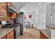 Functional kitchen features modern appliances, tile flooring, and an adjacent dining area at 2271 Smokey Sky Dr, Henderson, NV 89052