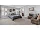 Serene main bedroom showcasing natural light with ample sitting area, providing relaxation and comfort at 2271 Smokey Sky Dr, Henderson, NV 89052