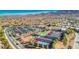 A lovely aerial view of a community with tennis courts, a gym, and lush green spaces at 2522 Darda St, Henderson, NV 89044
