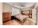 This bedroom features hardwood floors, a ceiling fan, and plantation shutters at 2522 Darda St, Henderson, NV 89044