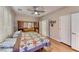 This large bedroom features hardwood floors, a ceiling fan, and a closet at 2522 Darda St, Henderson, NV 89044