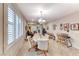 Bright dining area with a chandelier, tile flooring, and ample natural light at 2522 Darda St, Henderson, NV 89044