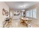 Bright dining space featuring a classic wood table set and natural lighting at 2522 Darda St, Henderson, NV 89044