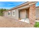 Inviting front entryway with well-maintained landscaping and charming architectural details at 2522 Darda St, Henderson, NV 89044
