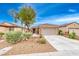 Charming single-story home with a well-manicured front yard and a two-car garage at 2522 Darda St, Henderson, NV 89044