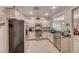 Well-lit kitchen with granite counters and stainless steel appliances at 2522 Darda St, Henderson, NV 89044