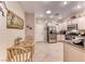 Bright eat-in kitchen features tile flooring, stainless appliances, and granite countertops at 2522 Darda St, Henderson, NV 89044