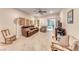 Inviting living room with tile flooring, cozy seating, and sliding glass doors at 2522 Darda St, Henderson, NV 89044