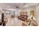 Open-concept living room featuring tile flooring, natural light, and a ceiling fan at 2522 Darda St, Henderson, NV 89044