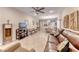Spacious living room with tile flooring, a ceiling fan, and ample seating arrangements at 2522 Darda St, Henderson, NV 89044
