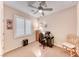 Bedroom is currently used as an office with a desk and plantation shutters at 2522 Darda St, Henderson, NV 89044