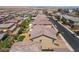 Aerial view of a neighborhood featuring well-maintained homes, streetscapes, and desert landscaping at 2575 Hazelburn Ave, Henderson, NV 89044