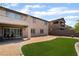 Spacious backyard featuring artificial turf, gravel landscaping, and a covered patio area perfect for entertaining at 2575 Hazelburn Ave, Henderson, NV 89044