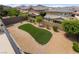 An aerial view of a backyard with artificial grass and desert landscaping at 2575 Hazelburn Ave, Henderson, NV 89044