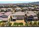 Aerial view of backyard featuring turf, desert landscaping, and a covered patio at 2575 Hazelburn Ave, Henderson, NV 89044