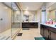 Large bathroom with a spacious walk-in shower, double vanity, and large mirrors at 2575 Hazelburn Ave, Henderson, NV 89044